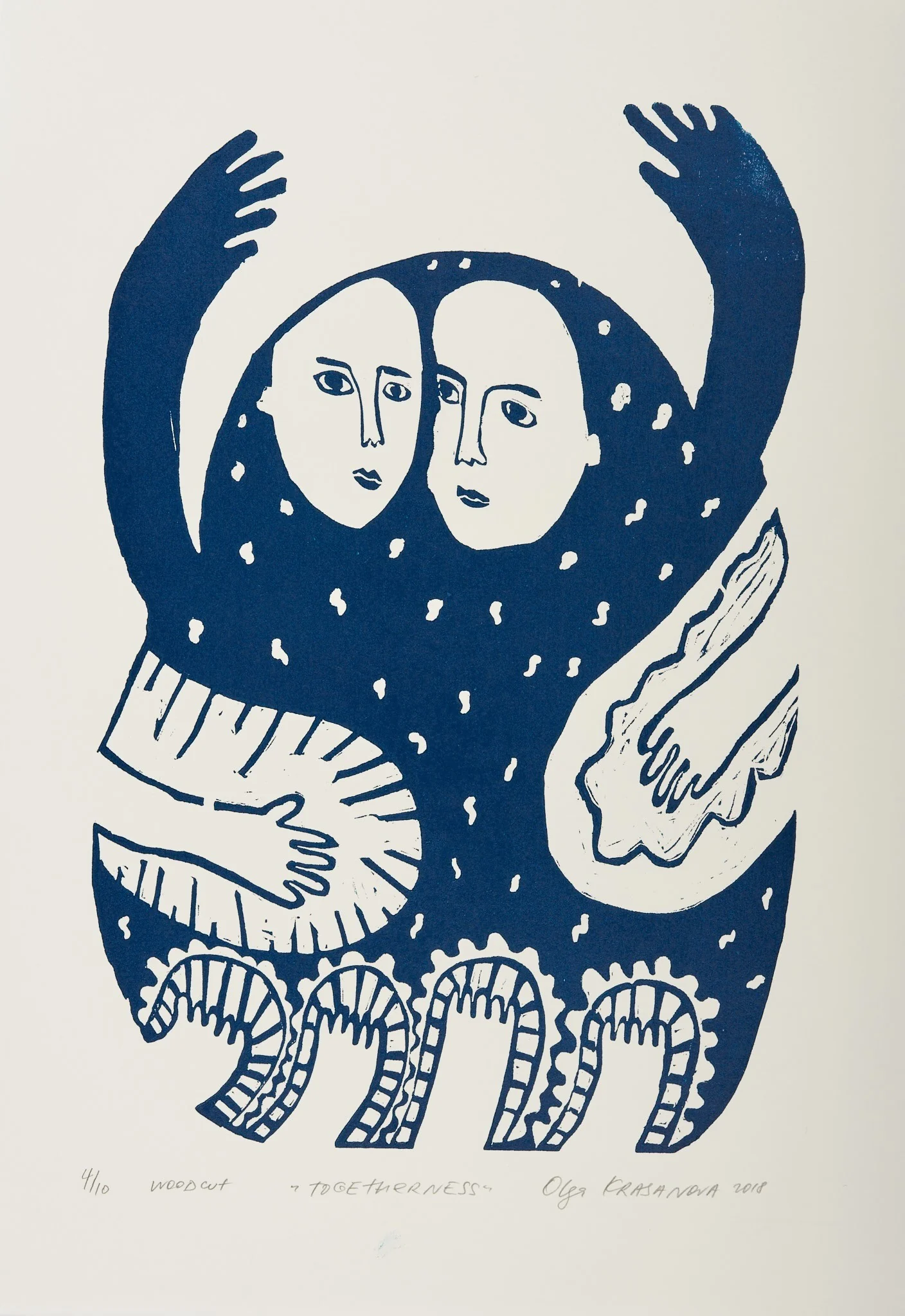 Togetherness, woodcut by Olga Krasanova — two faces beneath raised arms surrounded by patterned blue forms