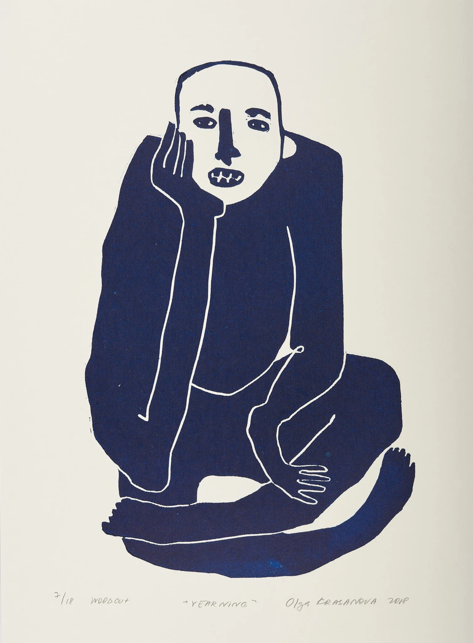 Yearning, woodcut by Olga Krasanova — a seated navy figure resting a cheek against an oversized hand